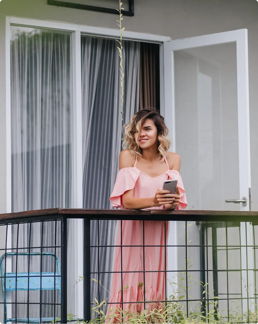 Resident on a modern balcony overlooking the neighbourhood